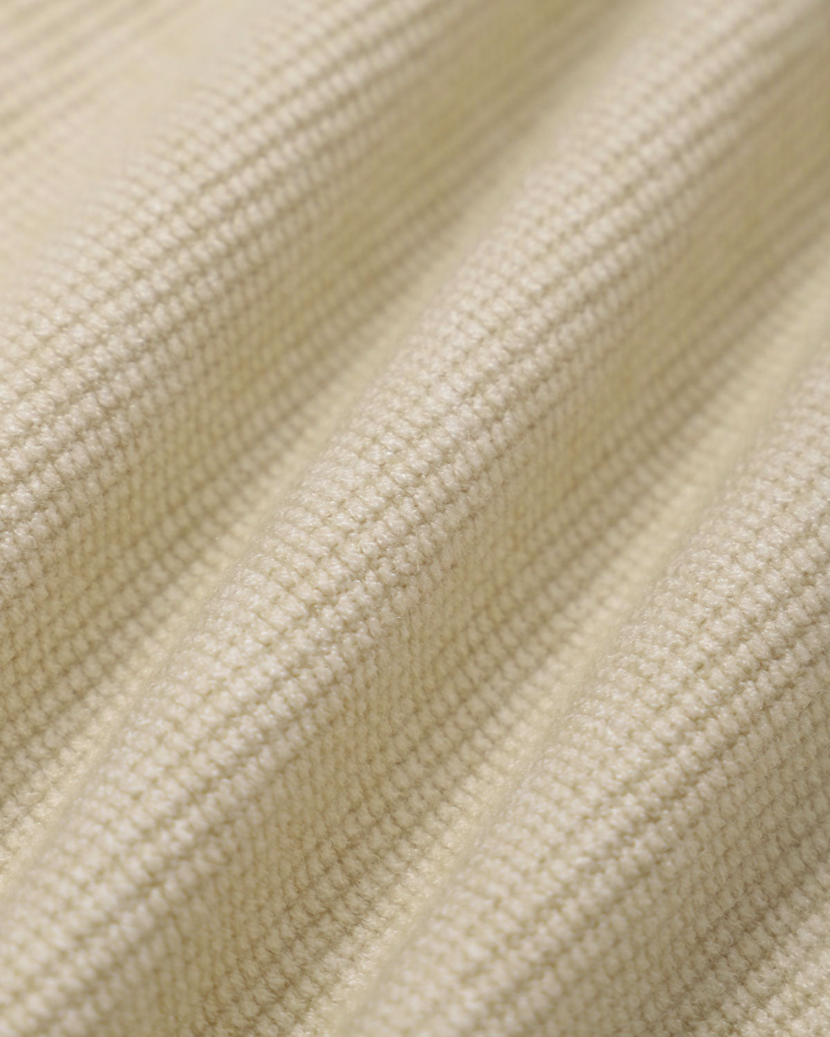 Beigefarbene, gerippte Strickjacke mit Reißverschluss