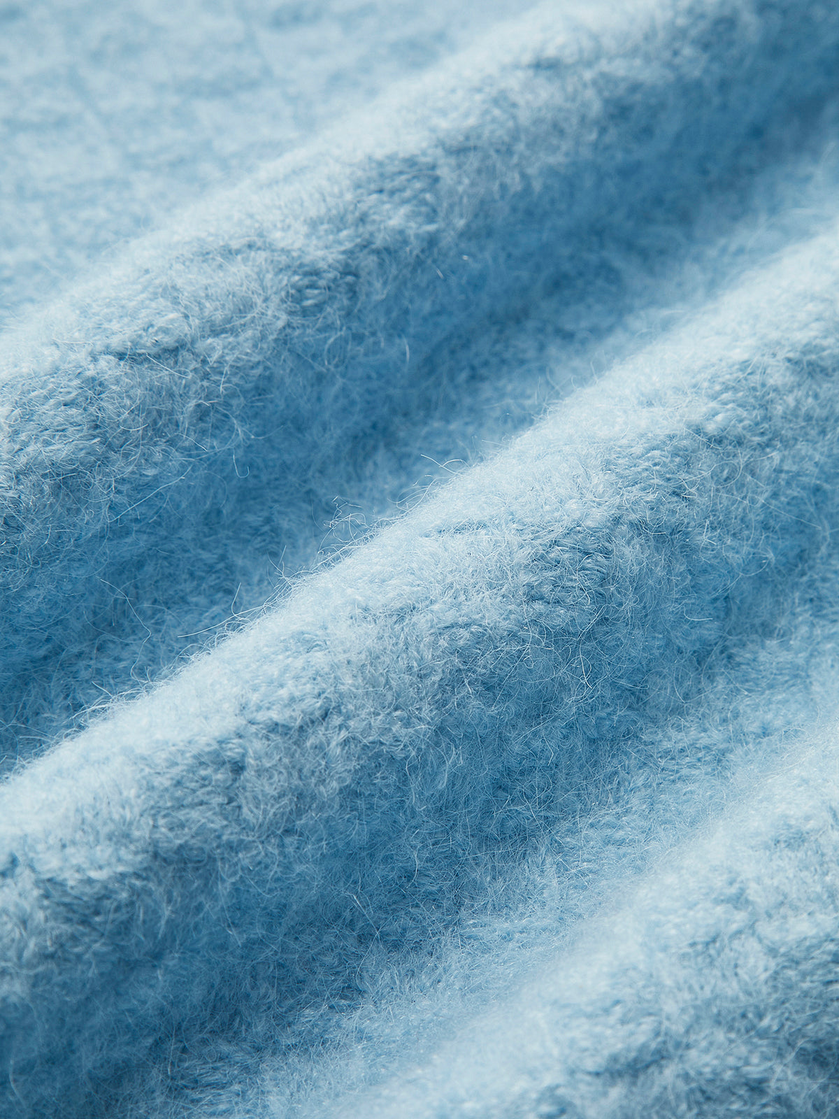 Strickweste mit Perlenbesatz und Kreuzmuster