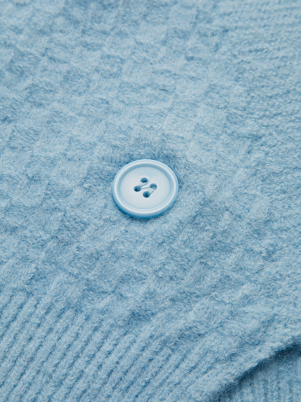 Strickweste mit Perlenbesatz und Kreuzmuster