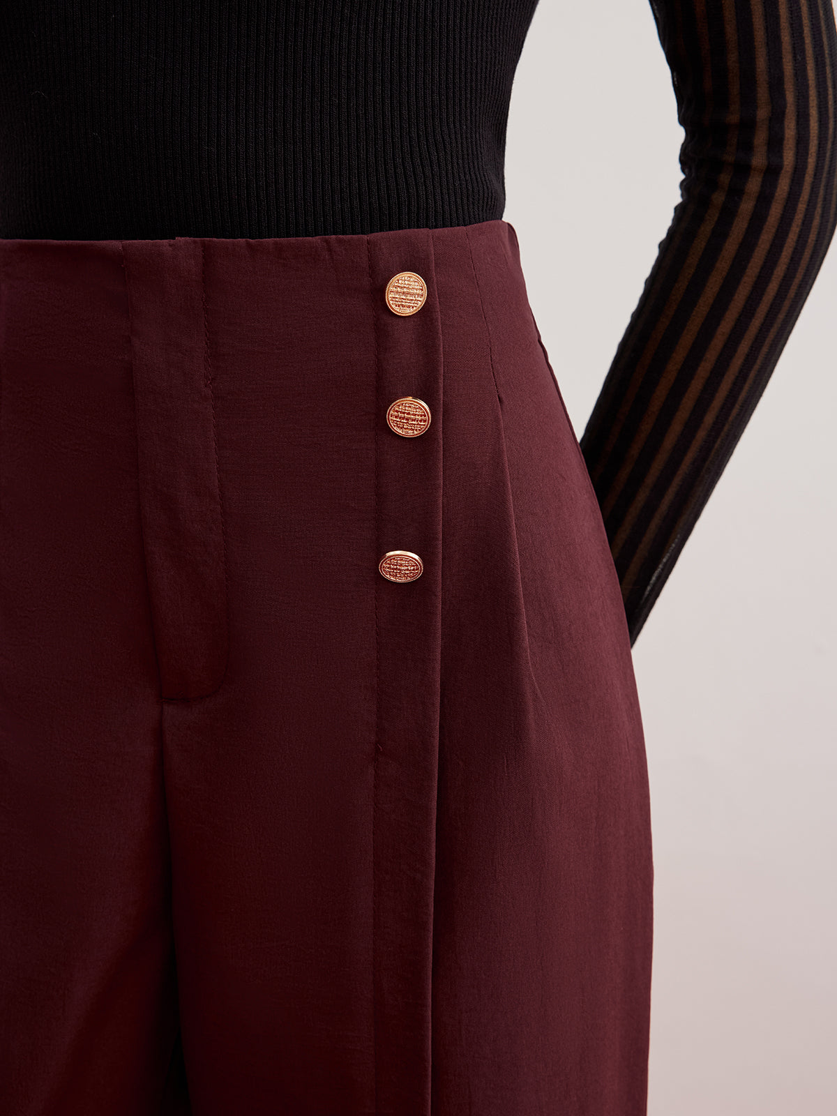Wide-leg trousers with button detail and slit.