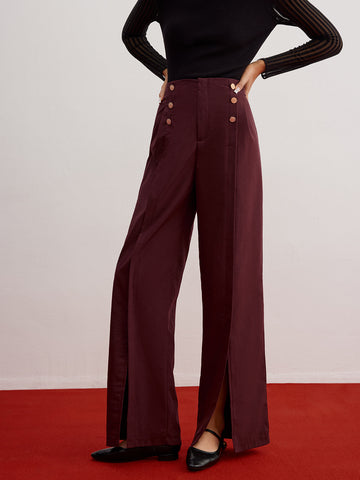 Wide-leg trousers with button detail and slit.