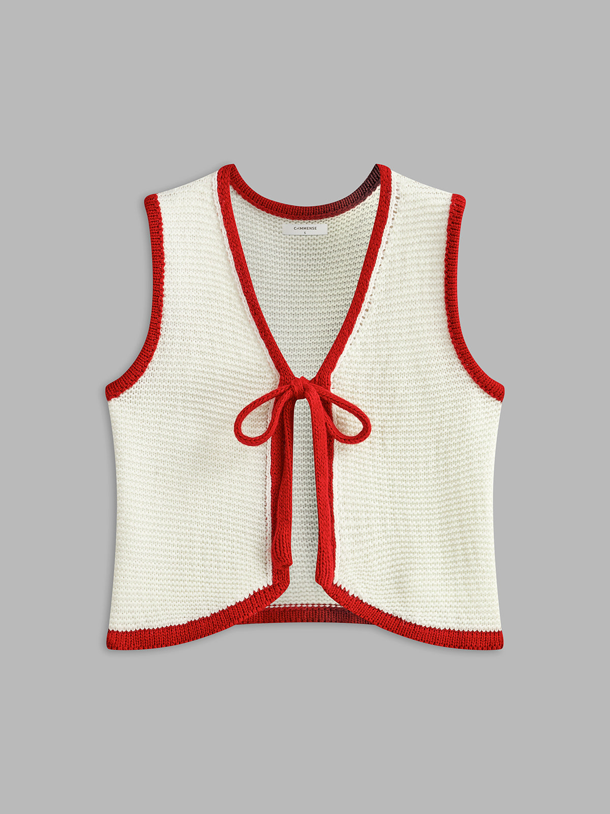 Strickweste mit Farbblockmuster und Knotenmuster