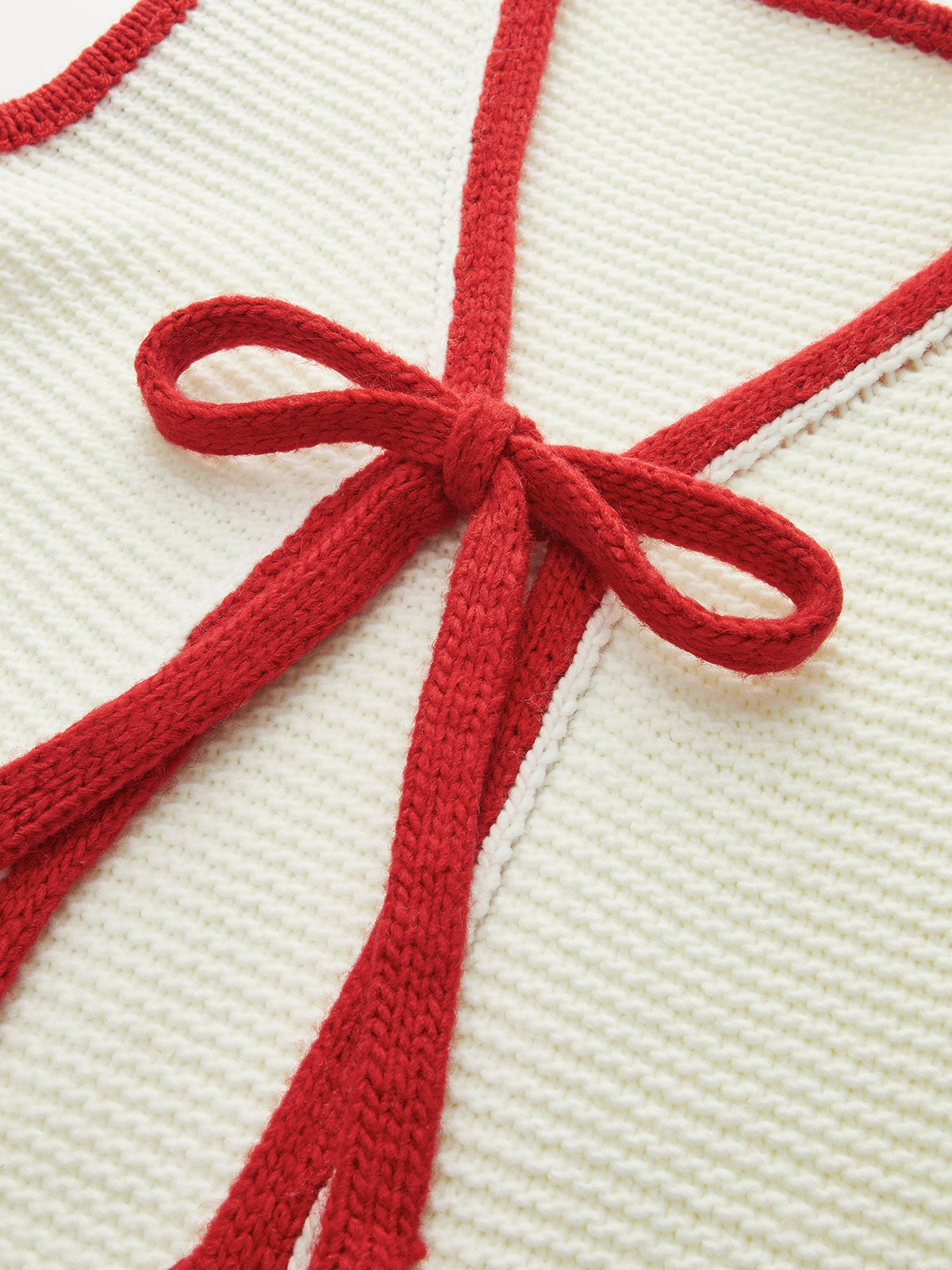 Strickweste mit Farbblockmuster und Knotenmuster