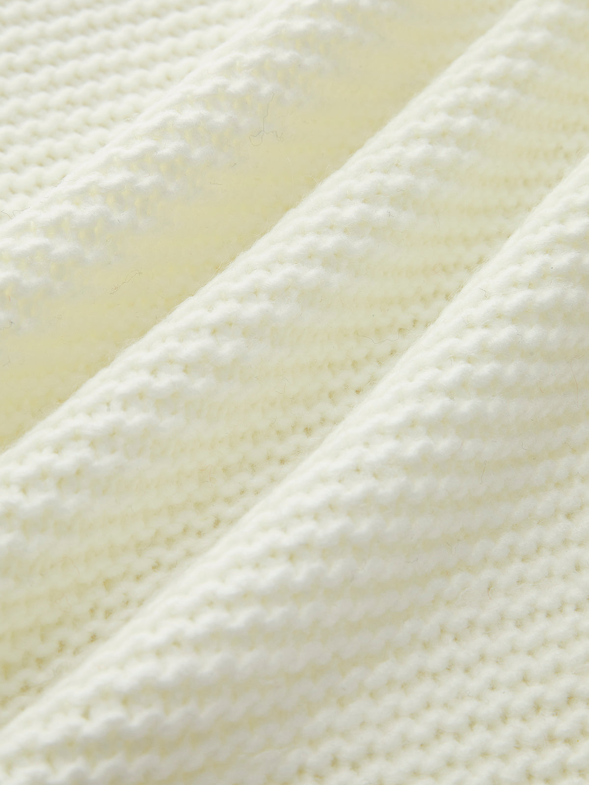 Strickweste mit Farbblockmuster und Knotenmuster