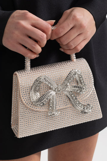 Funkelnde Strasshandtasche mit dekorativer Metallschleife – Champagner